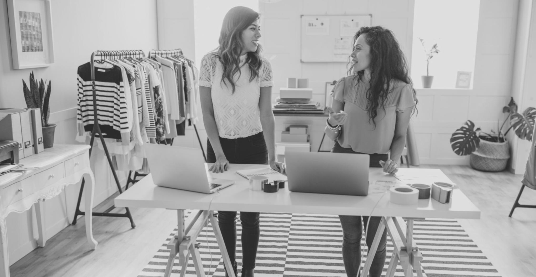 Student reviewing course materials and making notes during online session